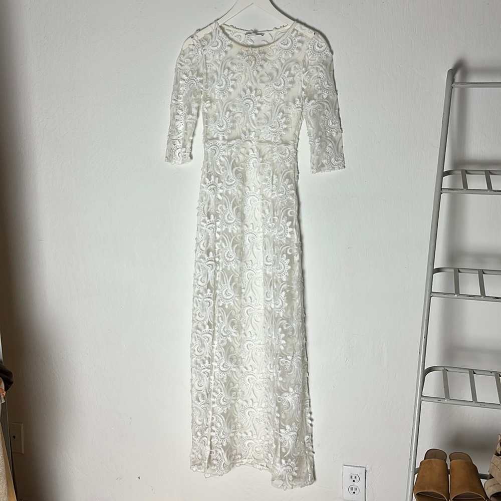 Coachella-ready see-through lace slip dress with a high leg slit